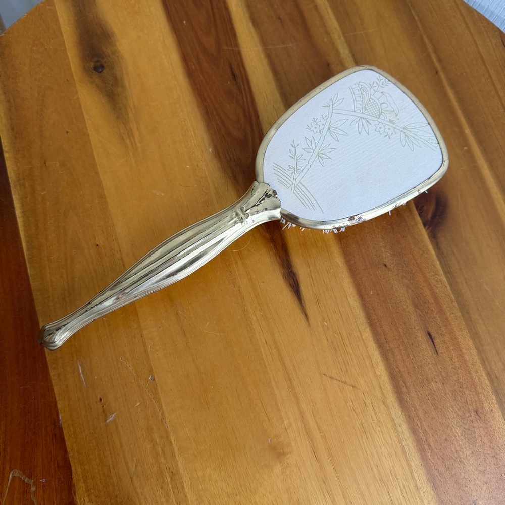 Vintage gold tone floral hair brush